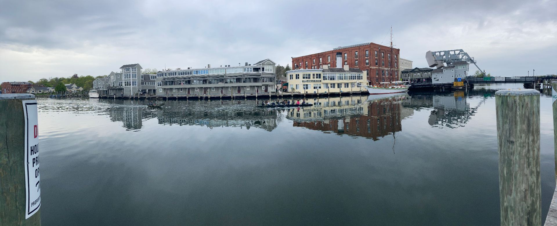 Mystic River boardwalk panorama with waterfront restaurants