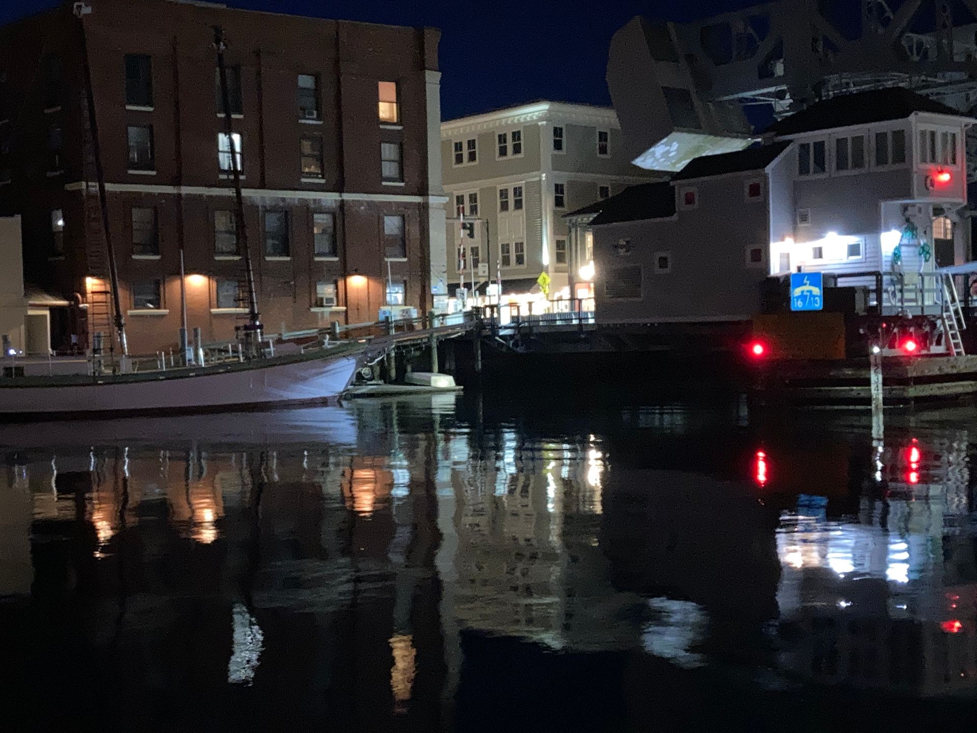 Mystic drawbridge and harbor reflections at night